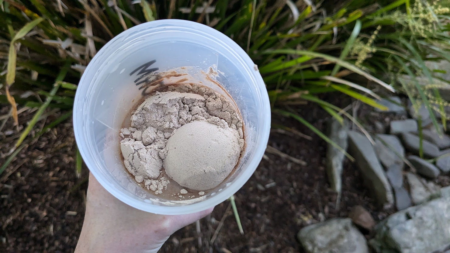 Greenback Choc protein powder in bottle