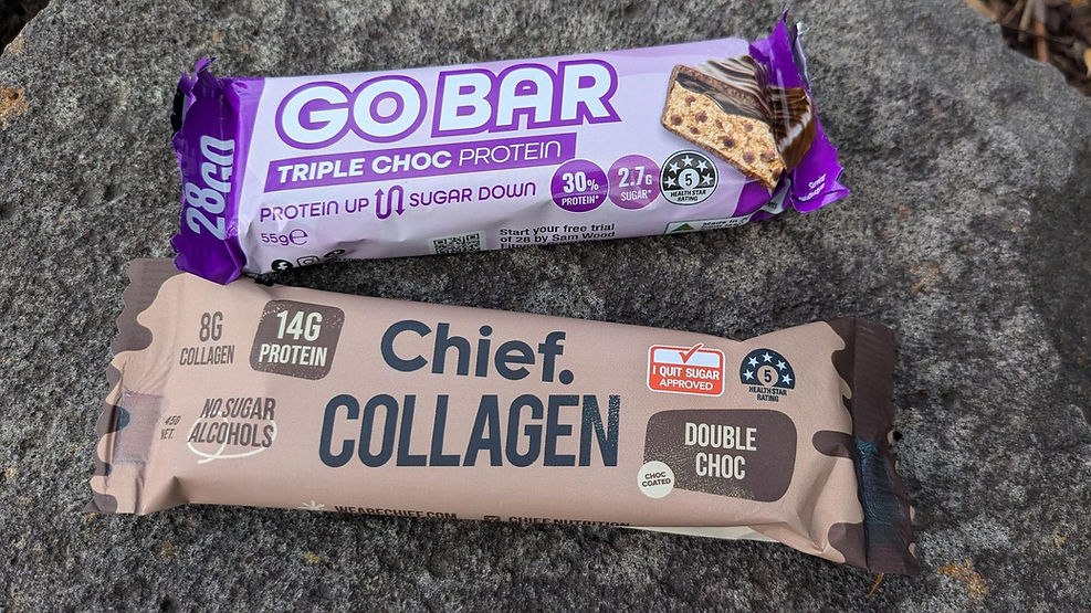 Chief Collagen and Go Protein Bars on a rock