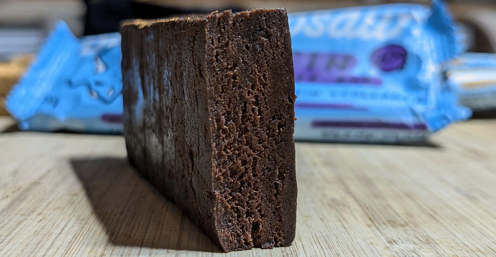 Chocolate protein bar cut open for texture