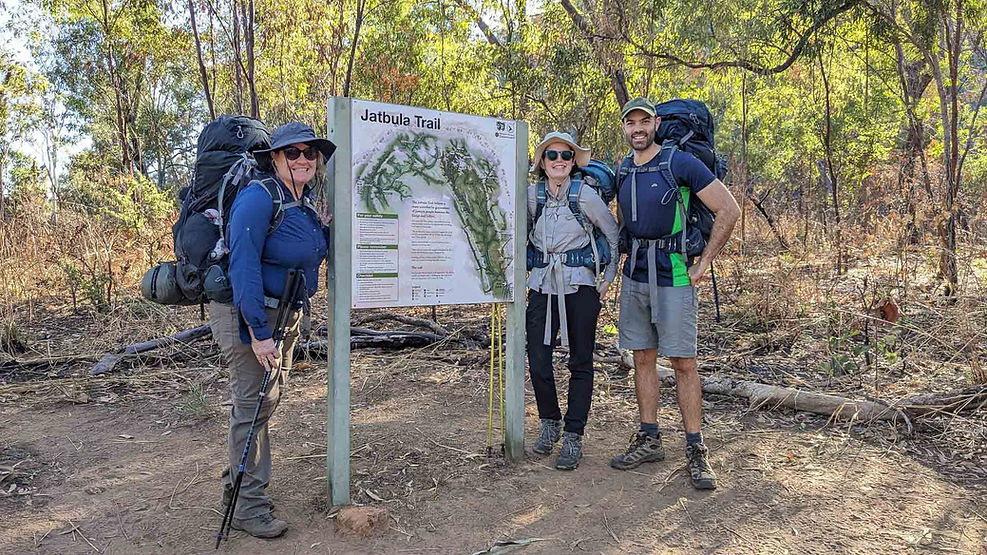 three hikers beside Jatbula Trailhead sign, NT