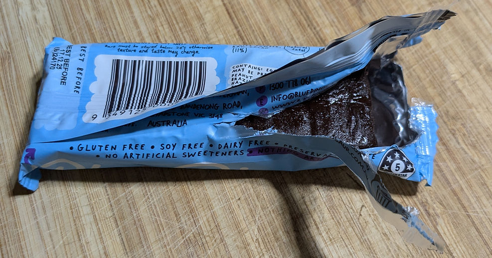 Blue dinosaur protein bar packaging_edited