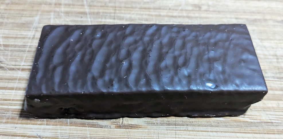 Naked CLIF Protein Bar showing chocolate shell